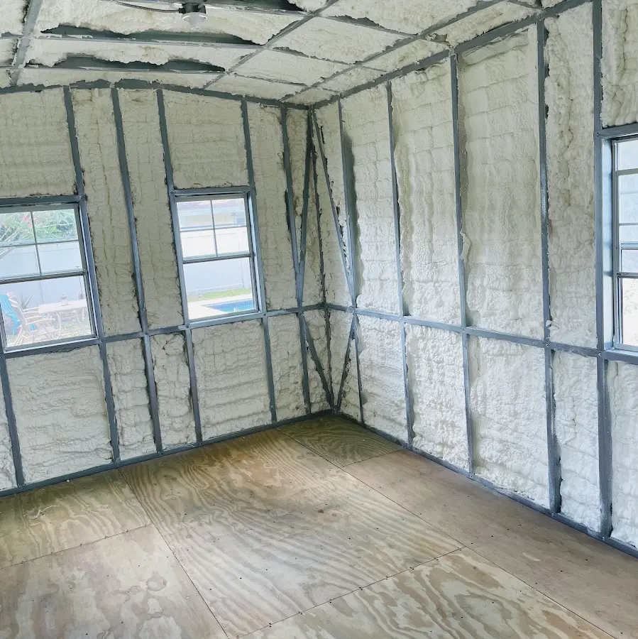 Closed-cell spray foam insulation applied to wall cavities in a residential project in Cumberland
